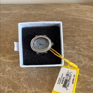 Invicta Angel ring watch Silver CZoval with pale blue sparkle face. Adjustable.